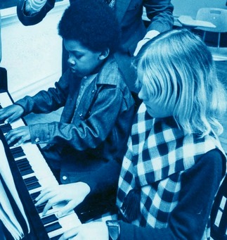 Two children at piano